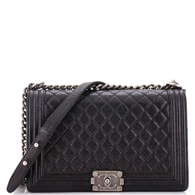 Christian Dior handbags with a snap - button closure and a decorative buckleBoy Flap Bag Quilted Caviar New Medium