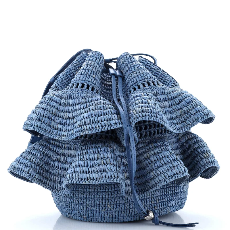 Christian Dior Saddle bags with a distressed leather finishPaula's Ibiza Ruffle Balloon Bucket Bag Woven Raffia