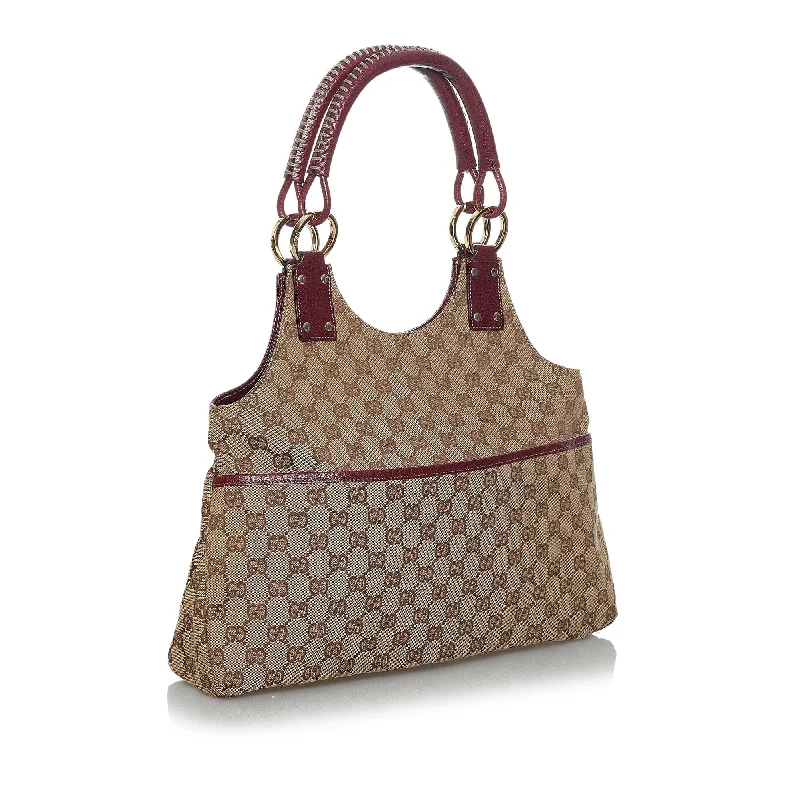 Ladies Gucci shoulder bags with a tassel decorationGucci GG Canvas Shoulder Bag (35156)